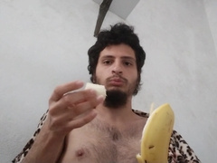 Homosexual munching bananas, man