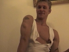 Shredded dude getting jerked off on a bed