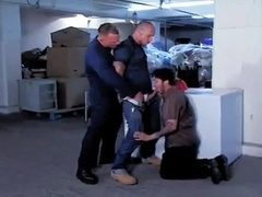 Boy by SEARS workers in the store's basement 2