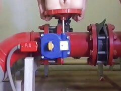 Having sex in the engine room.,There is a worker doing it i