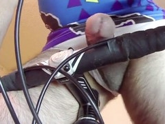 Cyclist with an enormous cock gets off with a fucking machine
