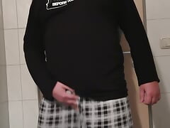 Dennis wanks in the hotel bathroom.