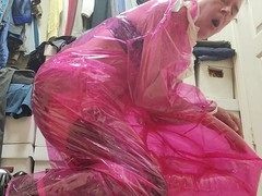 Diana in PVC sissy outfit enjoys solo play on a clear pink stool