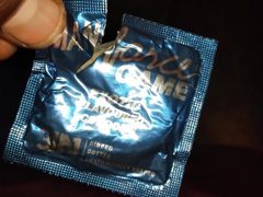 Putting on a condom and having sex with Randi