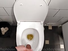 A handsome man with a big dick jerks off in a shopping mall with moans and screams