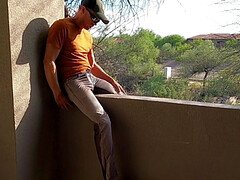 Pissing pants and jerking off on a hotel balcony