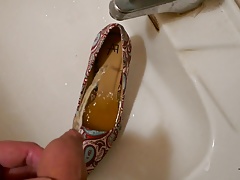 Piss in stiletto high heel