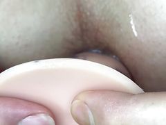 Princess close up pounding her hole with a dildo.