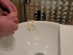 Urinating inwards a used love glove