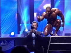 Massive BB Cedric McMillan posing on stage
