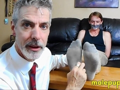 Professor Lennox tickles the feet of his student Jessie Russel through his stinky socks