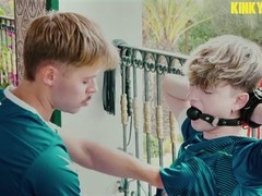 Young athlete Zacc Andrews dominates his obedient partner in sportswear