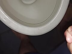 Peeing in the toilet with catheter in penis