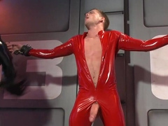 Insolent male slave plays in latex fetishes and lets the master fool around with his cock