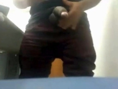 MILKING HIS BIG UNCUT BRAZILIAN DONKEY DICK AT WORK