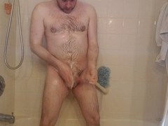Showering and playing with a big cock