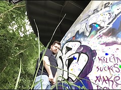 Degraded loser pisses next to a frequented path