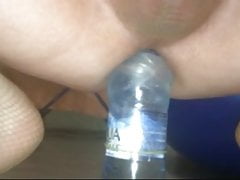 I sit down on a bottle
