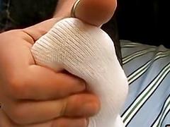 Asian twink teases with his soft feet and jerks off