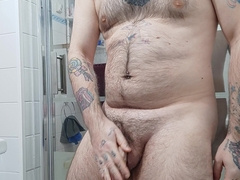 Unshaved boy drains before douche