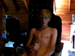 Naked guy with a hot body is jacking off in an armchair