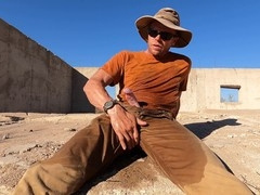 Spraying pee in the desert while jerking off under the hot sun