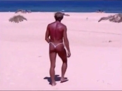 Beach Striptease: Tanned Hunk Bares All