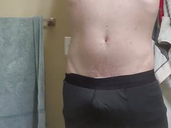 Sexy jock gets ready for a shower and pees