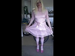 Sandra practising curtsey in her pink dress