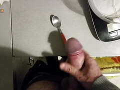 Handjob: jerking off over a small spoon