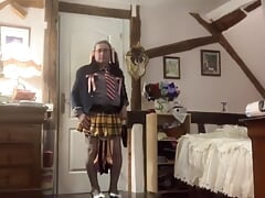 In a little schoolgirl outfit with a little yellow plaid skirt for a night out