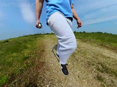 Freeballing walk in nature with a good-sized sweatpants erection