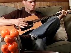 Twink plays guitar before showing his feet off and masturbating