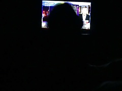 Stroking watching TV while wife is lying next to me