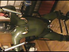 Green and green - swinged rubberslave gets an enjoying