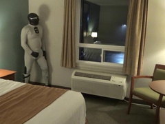 at motel window and door I jizz dressed in bastard wetsuit, silicone spandex hood