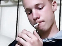 Cute blonde twink strokes his big cock solo while smoking