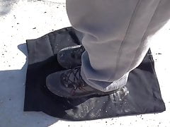cleaning shoes on black skirt