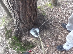 two friends pissing together a big puddle under the tree