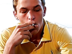 Attractive young man smoking solo and stroking his big cock
