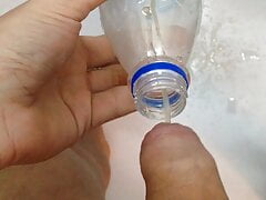 Pissing in bottle and pouring it over my cock