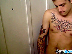 tattooed fag pokes an unexpected guest in the toilet