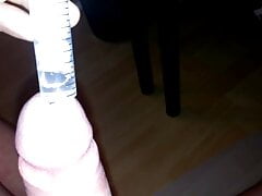 Cumshot with a dilator