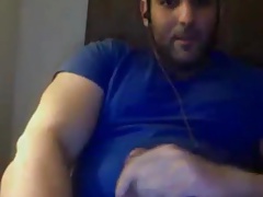 Beautiful bearded bear wanking on sofa