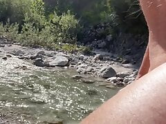 Wanking outdoor at the river with cumshot
