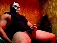 Buff guy in uniform giving himself a handjob with his massive cock