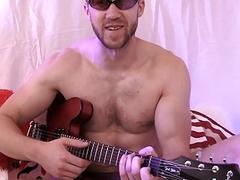 Dashing stud with a guitar rubs himself and jerks off