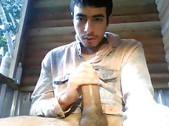 jacking a load out of a thick uncut cock outside