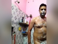 indian man taking bath nude