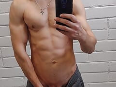 Handsome athletic man jerks off and makes selfie